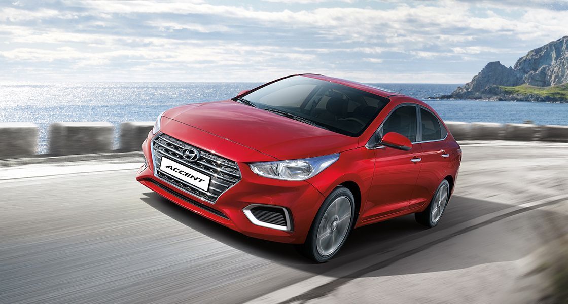 Red Hyundai Accent Quarter Front Look Moving