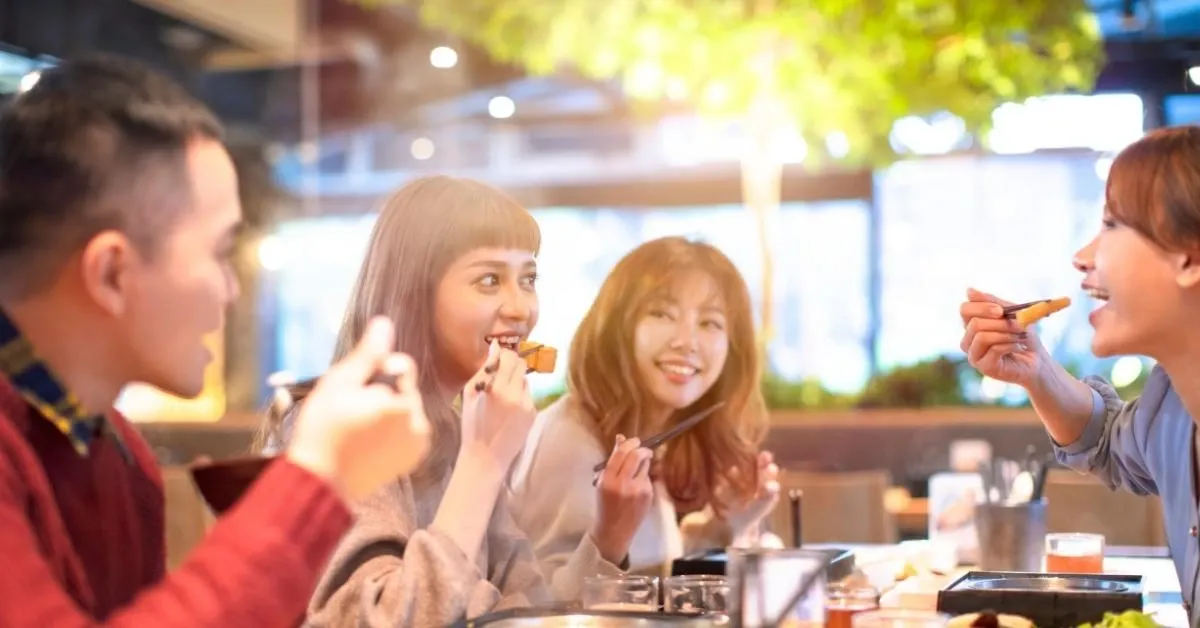 Friends eating out in a table 